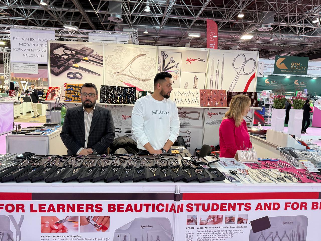 Exhibition visitors beside our scissors and beauty instrument displays. Beauty Düsseldorf 2025.