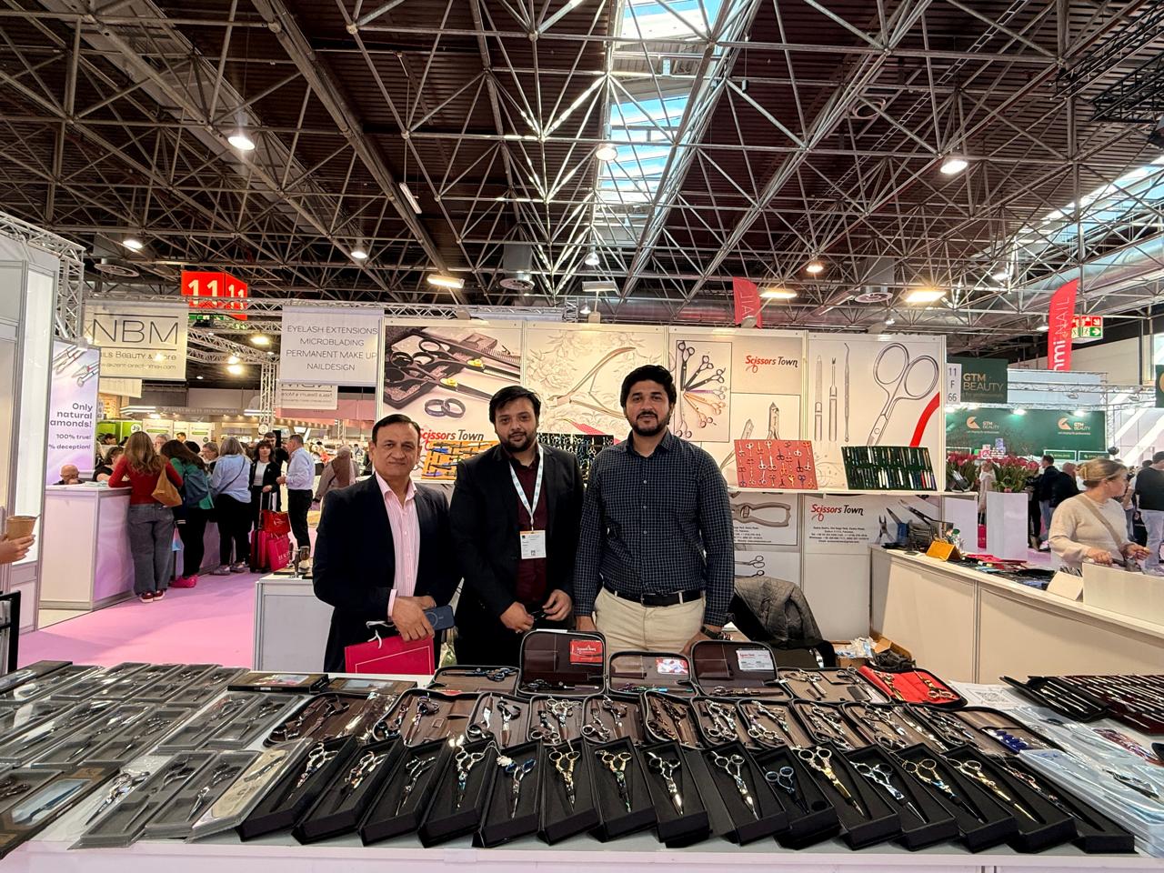 A group photograph beside our professional scissors and instrument sets. Beauty Düsseldorf 2025.