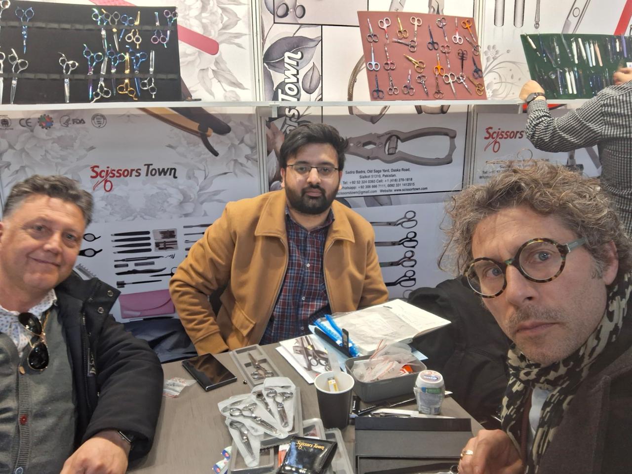 A photograph with visitors beside our scissors and instrument sets. Beauty Düsseldorf 2025.