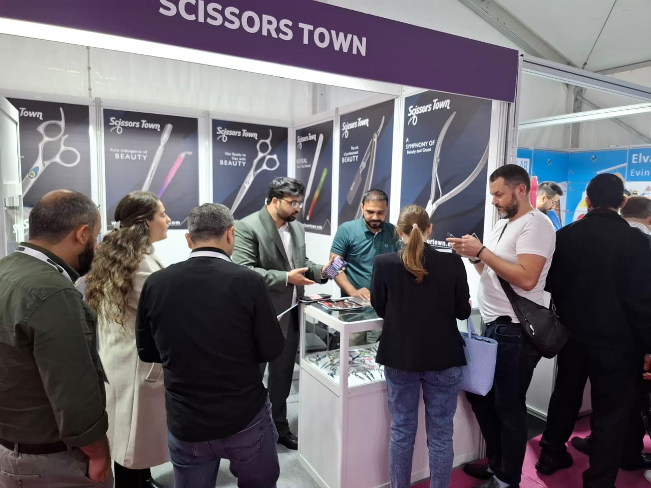 Our team speaks with visitors beside the beauty tool displays. Beauty Istanbul 2023.