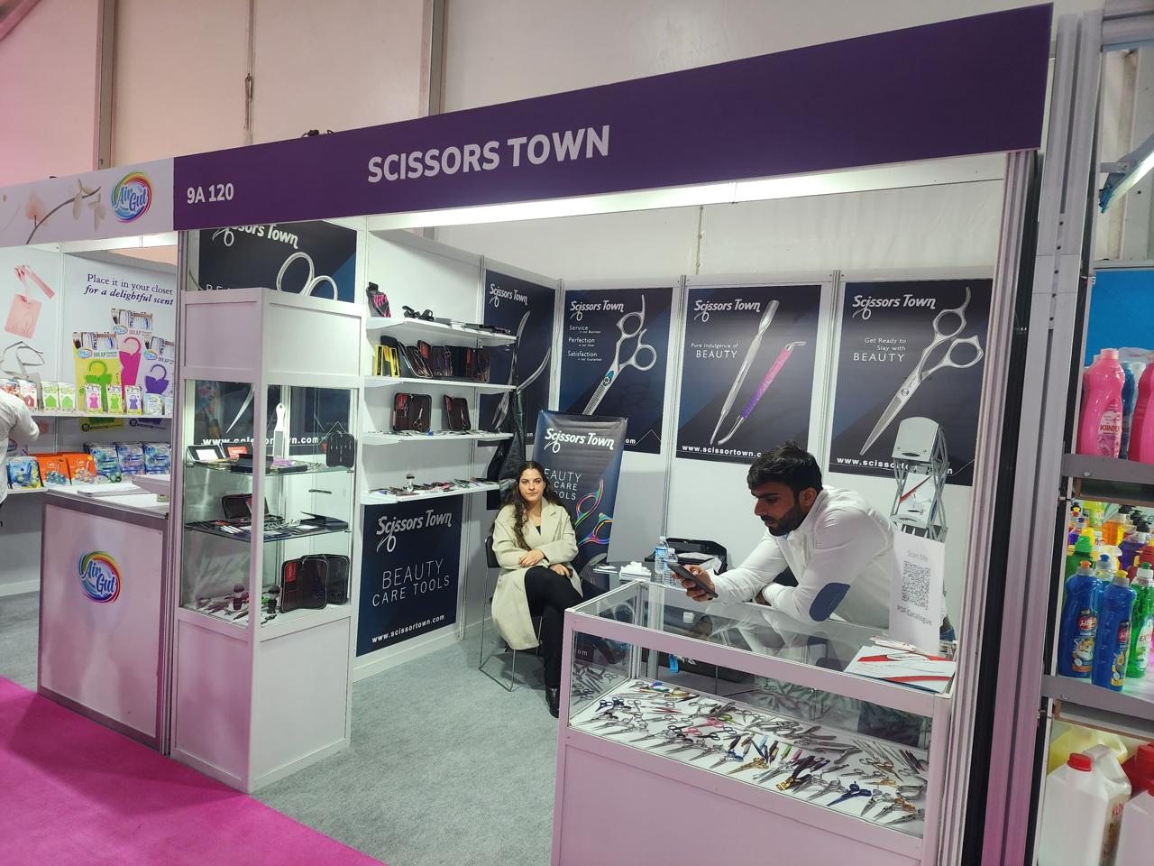 Professional scissors and beauty care tools presented in display cabinets. Beauty Istanbul 2023.