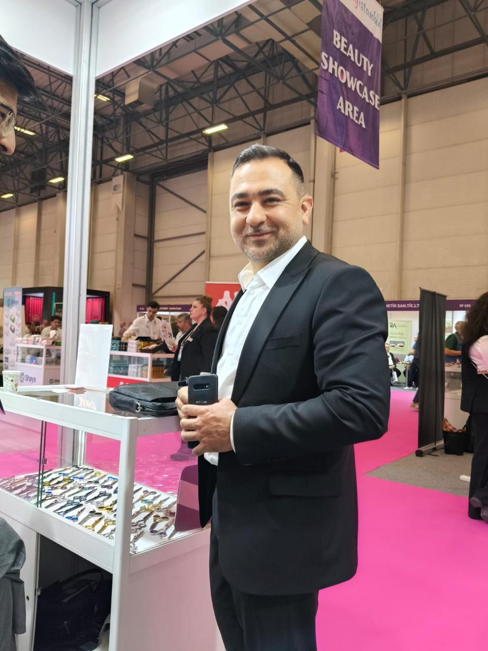 An exhibition visitor beside our scissors display cabinet. Beauty Istanbul 2025.