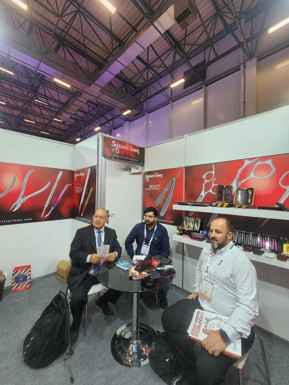 Exhibition visitors and our team seated beside the beauty tool displays. Beauty Istanbul 2026.